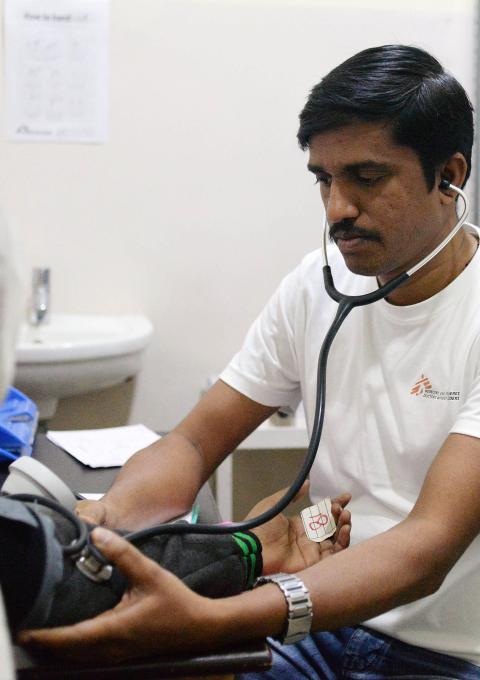 MSF Nurse Jijo Xavier checks the vitals of a patient at the PL Sharma District Hospital in Meerut city where MSF runs a Hepatitis C project in collaboration with the National Health Mission, providing free services.