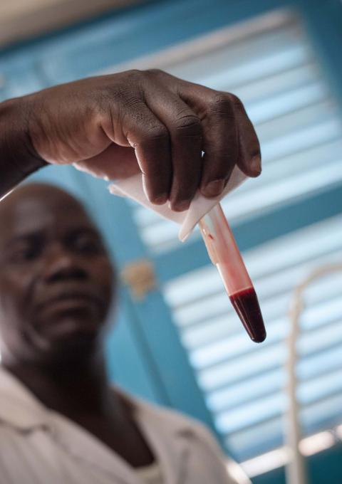 A nurse analyses a blood sample to perform a coagulation test following a snake bite at the Paoua hospital in northwestern Central African Republic, supported by MSF. 