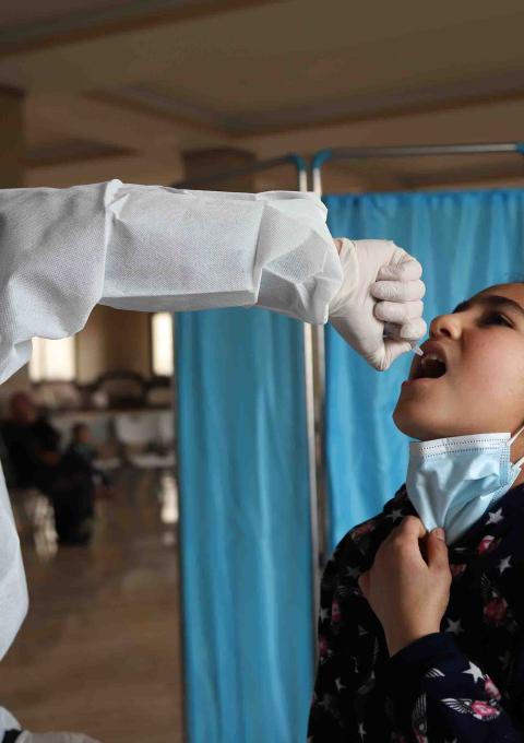 Child receiving a vaccine through an MSF routine vaccination campaign, Wadi Khaled, Akkar, Lebanon, February 2022.
