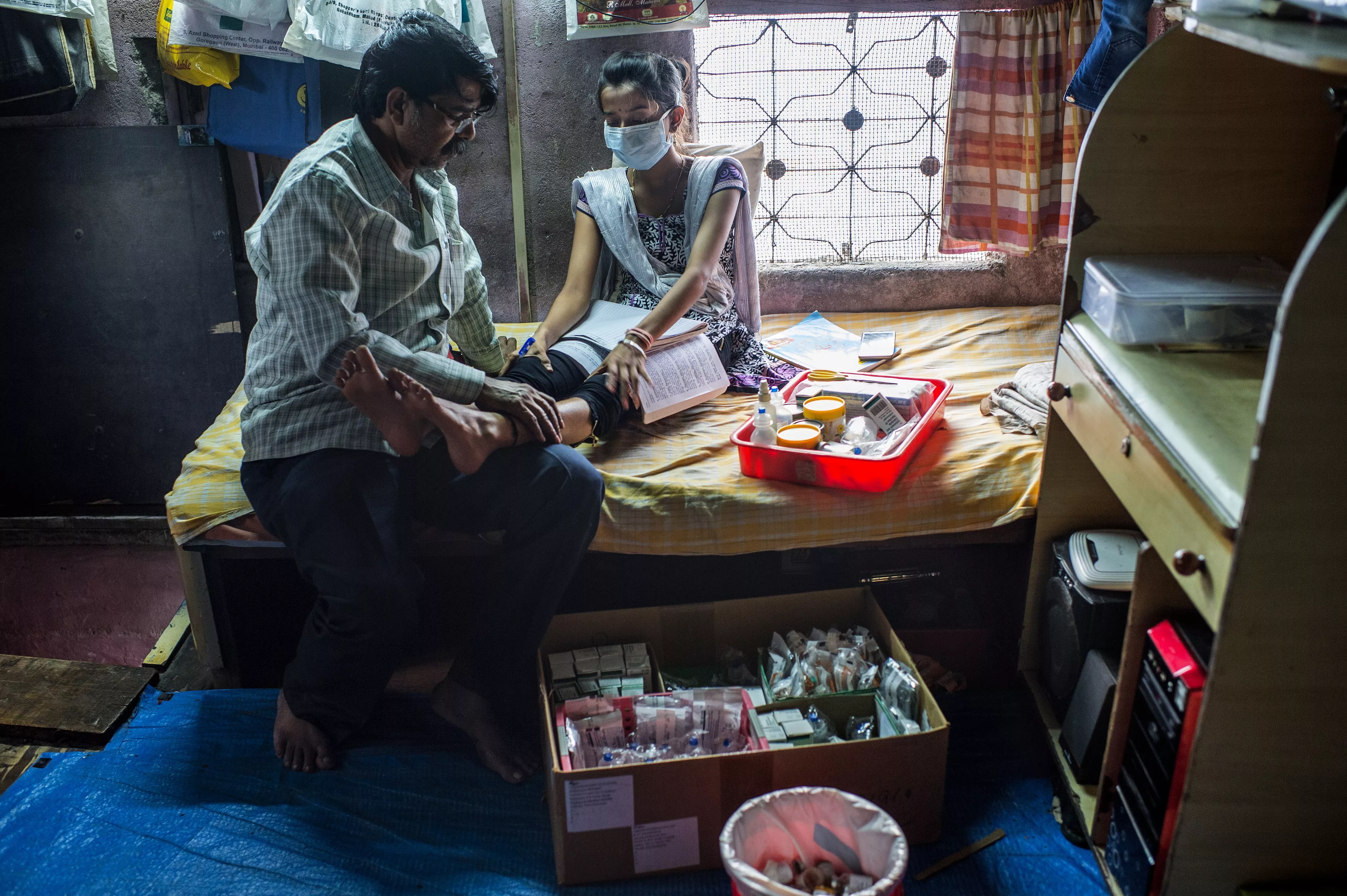 XDR-TB patient Nischaya, at home the Ambedkar Nagar area of Mumbai, with her TB medication.