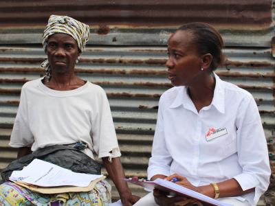 Ebola survivor, Jesse Wolatee, 65yrs, explains to an MSF Ebola survivor clinic staff post-Ebola syndrome she is experiencing.