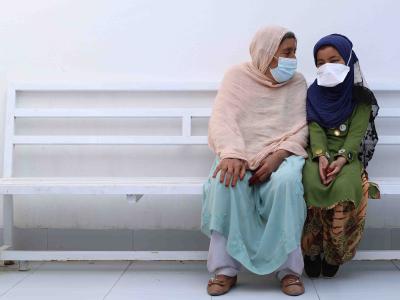 Bibi Amina and her granddaughter Sayeeda wait to see a doctor at MSF's DR-TB hospital in Kandahar, Afghanistan, September 2022