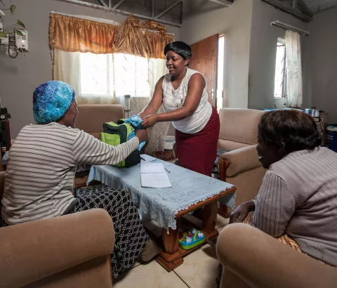 MSF has been piloting "Community Anti-Retroviral Treatment Groups" (CAGs) as a model of care for stable HIV+ patients in rural districts of southern Africa, where HIV prevalence is at its highest. Community Care Giver Nonhlanhla Ngema delivers anti-retrovirals to Elizabeth.